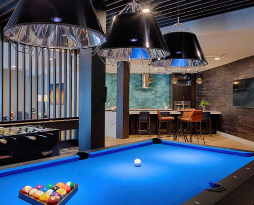 Clubroom with game area featuring pool, foosball and shuffleboard